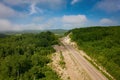 Aerial view of a black car driving on a country road Royalty Free Stock Photo
