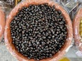 Aerial view of black olives at market stand in Domodossola, Italy.