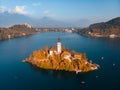 Aerial view of Bled island on lake Bled, and Bled castle and mountains in background, Slovenia. Royalty Free Stock Photo