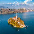 Aerial view of Bled island on lake Bled, and Bled castle and mountains in background, Slovenia. Royalty Free Stock Photo