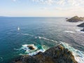 Aerial view of the Bloods Islands and Lighthouse, Corsica, France: rocks, waves and sailboat Royalty Free Stock Photo