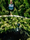 Aerial view of blue lake with green forests in Finland. Wooden house, sauna, boats and fishing pier by the lake Royalty Free Stock Photo