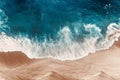 Aerial view of the blue ocean waves on the beach. Beautiful sandy beach with blue sea. Lonely sandy beach with beautiful waves.