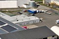 Aerial view of blue photovoltaic solar panels mounted on industrial building roof for producing green ecological Royalty Free Stock Photo