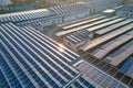 Aerial view of blue photovoltaic solar panels mounted on industrial building roof for producing green ecological Royalty Free Stock Photo