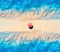 Aerial view of blue sea on both sides and beach with umbrella Royalty Free Stock Photo