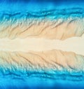 Aerial view of blue sea on the both sides empty sandy beach Royalty Free Stock Photo