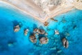 Aerial view of blue sea, rocks in clear water, white sandy beach Royalty Free Stock Photo