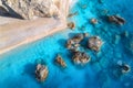 Aerial view of blue sea, rocks in clear water, white sandy beach Royalty Free Stock Photo