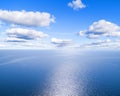 Aerial view of a blue sea water background and sun reflections. Aerial flying drone view. Waves water surface texture on sunny tro Royalty Free Stock Photo