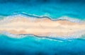 Aerial view of blue sea with waves on the both sides and people Royalty Free Stock Photo
