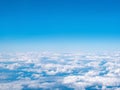 Aerial view of blue sky and white Clouds. Top view from airplane Royalty Free Stock Photo