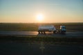 Aerial view of blurred fast moving cement cargo truck driving on highway hauling goods. Delivery transportation and Royalty Free Stock Photo