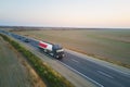 Aerial view of blurred fast moving fuel cargo truck driving on highway hauling goods. Delivery transportation and