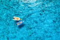 Aerial view of the boat in clear blue water at sunny day Royalty Free Stock Photo