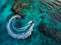 Aerial View of Boat Creating Circular Wake in Turquoise Waters Royalty Free Stock Photo