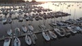 Aerial view of boat dock, yachts. Sunny morning, summer, sunlight