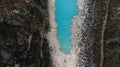 Aerial view on a boat with four tourists floating on turquoise water