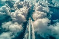 aerial view of boat navigating a pathway through towering cumulus formations