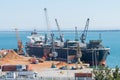Aerial view of boat in the process of unloading wood chips carrier to the port of Setubal