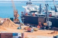 Aerial view of boat in the process of unloading wood chips carrier to the port of Setubal