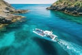 Aerial view of boat in turquoise sea with rocks and blue sky, Aerial view of a rib boat with snorkelers and divers at the Royalty Free Stock Photo