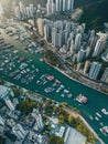 Aerial view of boats on the Aberdeen harbor near downtown buildings in Hong Kong