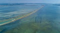 Aerial view of boats in canal in lagoon of Mediterranean sea Etang de Thau water from above, travel by barge in France Royalty Free Stock Photo