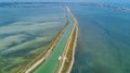 Aerial view of boats in canal in lagoon of Mediterranean sea Etang de Thau water from above, travel by barge in France Royalty Free Stock Photo