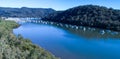 Aerial View Of Boats Moored On Hawkesbury River, Brooklyn, Australia With Blue Water Surrounded By Eucalyptus Gum Trees In Backgro