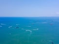 Aerial view of boats in Pattaya sea, beach with blue sky for travel background. Chonburi, Thailand