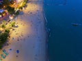 Aerial view of boats in Pattaya sea, beach at night, and urban city with blue sky for travel background. Chon buri Province, Royalty Free Stock Photo