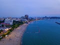 Aerial view of boats in Pattaya sea, beach at night, and urban city with blue sky for travel background. Chon buri Province, Royalty Free Stock Photo