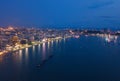 Aerial view of boats in Pattaya sea, beach at night, and urban city with blue sky for travel background. Chon buri Province, Royalty Free Stock Photo