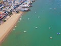 Aerial view of boats in Pattaya sea, beach, and urban city with blue sky for travel background. Chonburi, Thailand Royalty Free Stock Photo