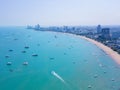 Aerial view of boats in Pattaya sea, beach, and urban city with blue sky for travel background. Chonburi, Thailand Royalty Free Stock Photo