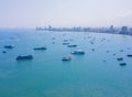 Aerial view of boats in Pattaya sea, beach, and urban city with blue sky for travel background. Chonburi, Thailand Royalty Free Stock Photo