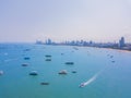 Aerial view of boats in Pattaya sea, beach, and urban city with blue sky for travel background. Chonburi, Thailand Royalty Free Stock Photo