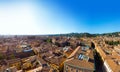 Aerial view of Bologna, Italy at sunset. Colorful sky over the historical city center with car traffic and old buildings roofs. Royalty Free Stock Photo