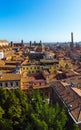 Aerial view of Bologna, Italy at sunset. Colorful sky over the historical city center with car traffic and old buildings roofs. Royalty Free Stock Photo