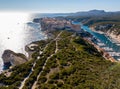 Aerial view of Bonifacio old town built on cliffs of white limestone, cliffs. Harbor. Corsica, France