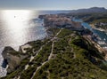 Aerial view of Bonifacio old town built on cliffs of white limestone, cliffs. Harbor. Corsica, France