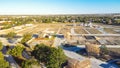 Aerial view brand new model house at construction site of master planned community near Dallas, Texas, USA