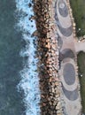 Aerial view of a breakwater with concrete cubes by the waves