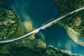 Aerial view of bridge asphalt road with cars and blue water lake and green woods in Finland Royalty Free Stock Photo