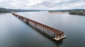 Aerial view of bridge construction over a river, with massive steel framework visible, soft daylight, and water reflections Royalty Free Stock Photo