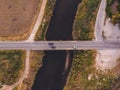 Aerial view of the bridge going over the water with the cars driving on it Royalty Free Stock Photo