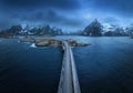 Aerial view of bridge, island, sea, snowy mountains in fog