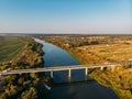 Aerial view of bridge over Don river in Voronezh, autumn landscape from above view with highway road and car transportation