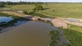 Aerial view of a bridge over a lagoon in typical rural landscape of Pantanal wetlands, Mato Grosso, Brazil